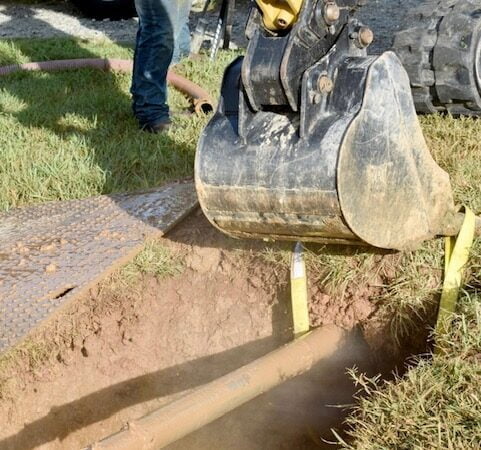 Holding the air hammer to get right level to ensure the hammer goes in