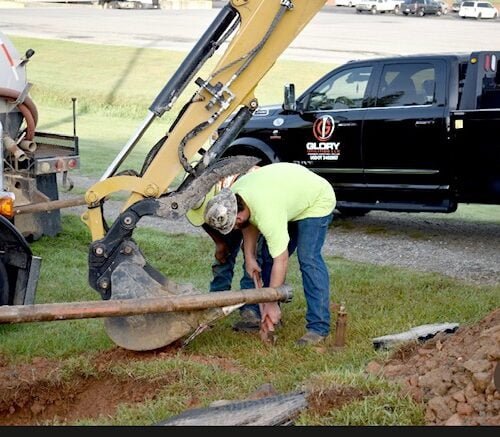 Employees are installing the hammer to start drilling