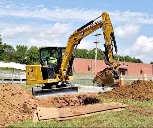 Excavating-digging a hole to begin drilling
