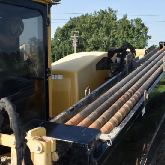 a Vermeer Drill holding rods 